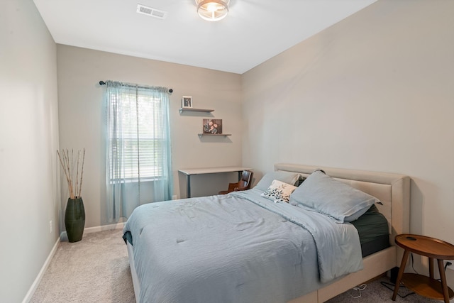 bedroom featuring carpet floors, baseboards, and visible vents