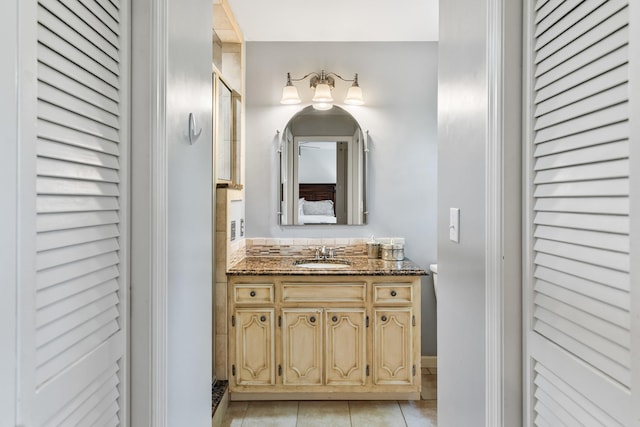 bathroom with tile patterned floors and vanity