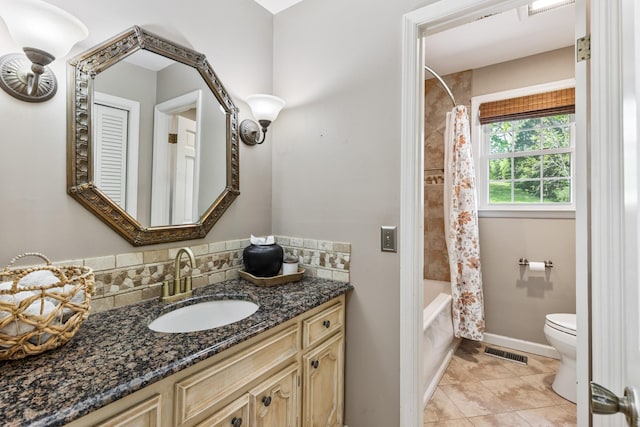 bathroom featuring tile patterned flooring, vanity, toilet, shower / bathtub combination with curtain, and visible vents