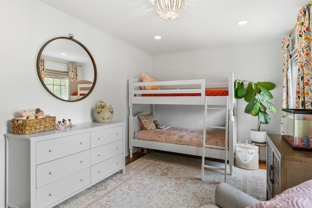 bedroom with recessed lighting, crown molding, and wood finished floors