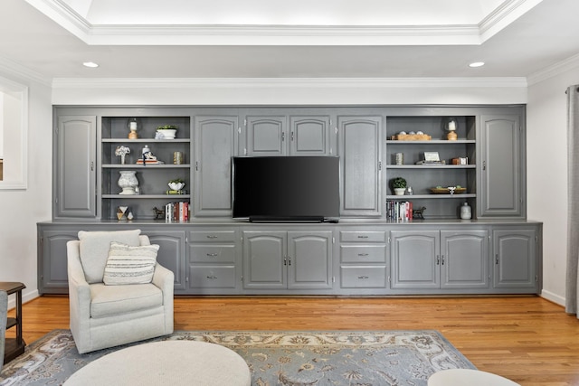 living room featuring recessed lighting, ornamental molding, and light wood finished floors