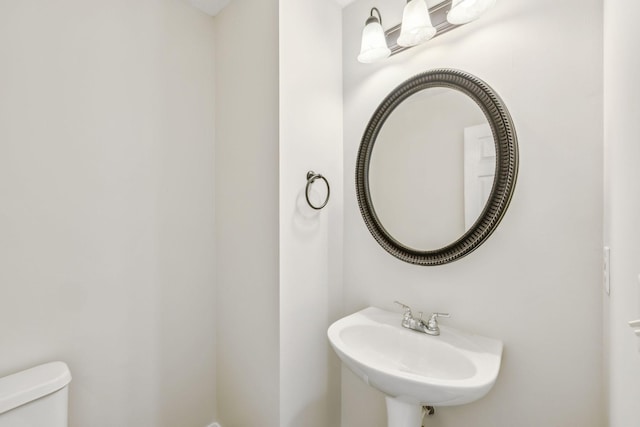 bathroom featuring a sink and toilet
