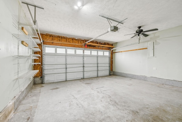 garage with a garage door opener and electric panel