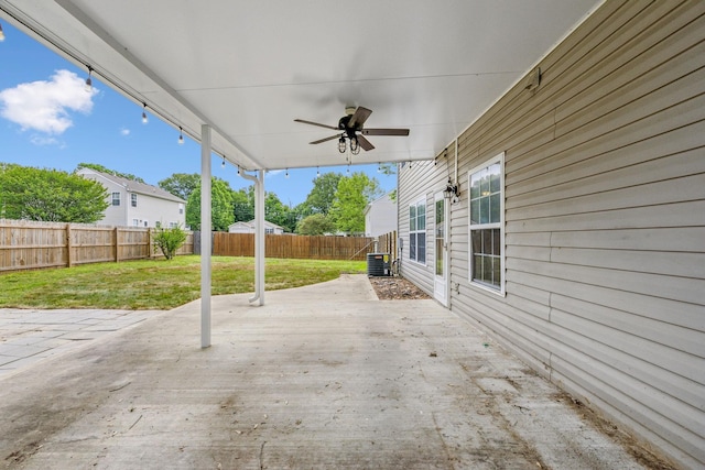 view of patio with a fenced backyard and a ceiling fan