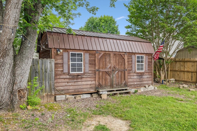 view of shed with fence