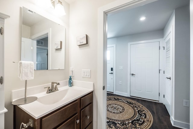 1034 Wilkinson Ln, White House, TN 37188 - bathroom with baseboards, wood finished floors, and vanity