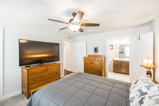 1034 Wilkinson Ln, White House, TN 37188 - bedroom featuring visible vents, a sink, baseboards, a ceiling fan, and ensuite bath
