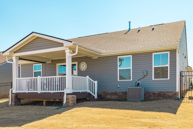 1034 Wilkinson Ln, White House, TN 37188 - back of property with fence, covered porch, roof with shingles, a lawn, and central air condition unit