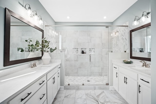 bathroom with a sink, a stall shower, and two vanities