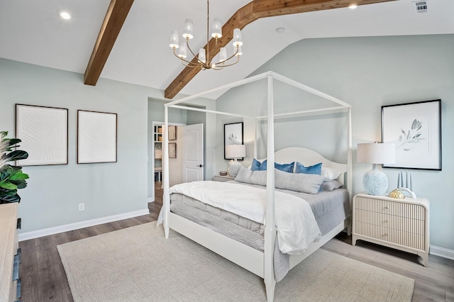 bedroom with visible vents, an inviting chandelier, wood finished floors, baseboards, and lofted ceiling with beams