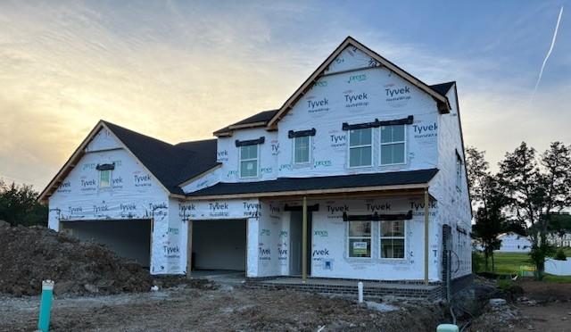 1070 Inez Dr, Smyrna, TN 37167 - property in mid-construction with an attached garage and covered porch