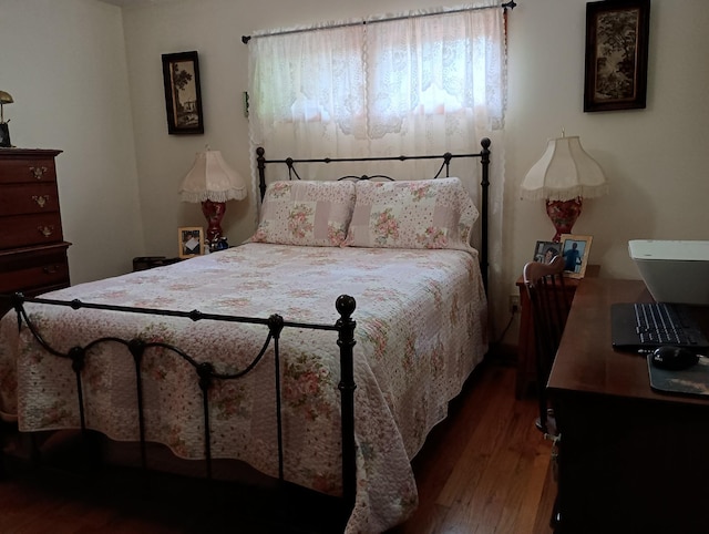 bedroom with wood finished floors