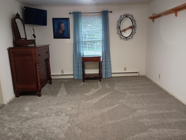 unfurnished bedroom featuring carpet floors, baseboards, and a baseboard heating unit