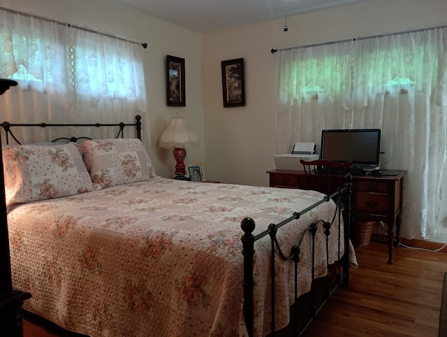 bedroom with wood finished floors