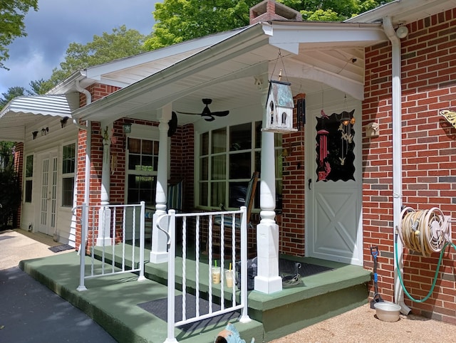 property entrance with covered porch and brick siding