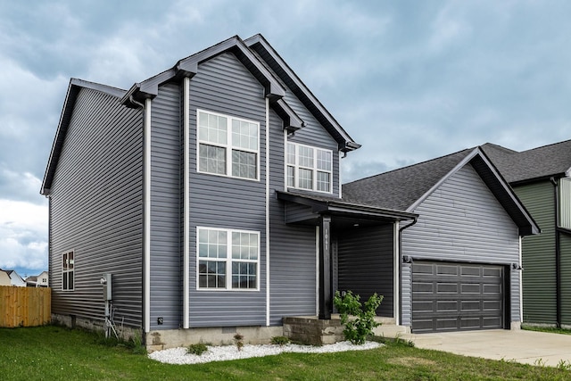 traditional-style home with fence and concrete driveway