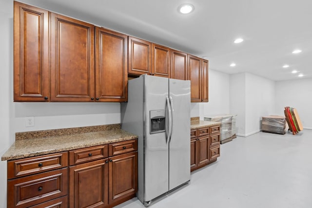8224 Victory Trl, Brentwood, TN 37027 - kitchen featuring stainless steel fridge with ice dispenser, finished concrete floors, recessed lighting, and brown cabinetry