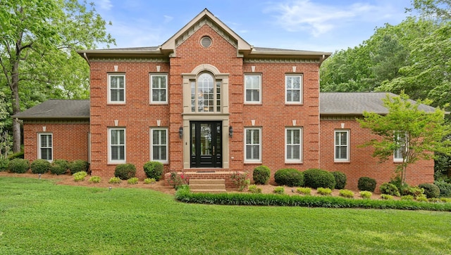 8224 Victory Trl, Brentwood, TN 37027 - colonial-style house with a front lawn, brick siding, and a shingled roof