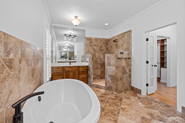 8224 Victory Trl, Brentwood, TN 37027 - bathroom with a soaking tub, walk in shower, crown molding, tile walls, and vanity