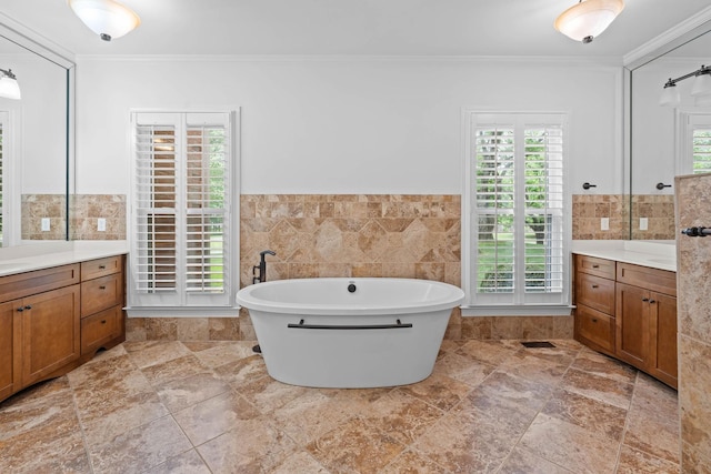 8224 Victory Trl, Brentwood, TN 37027 - bathroom with crown molding, vanity, a soaking tub, tile walls, and a wainscoted wall