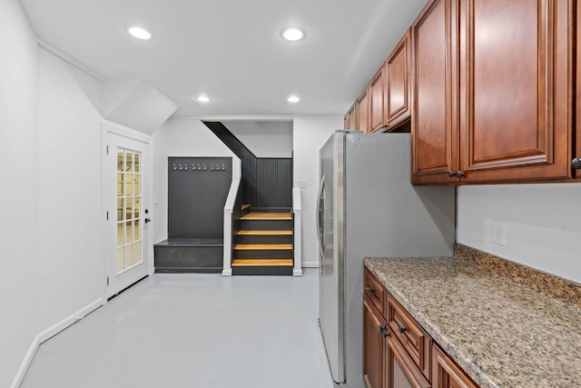 8224 Victory Trl, Brentwood, TN 37027 - kitchen featuring freestanding refrigerator, recessed lighting, concrete floors, and light stone countertops