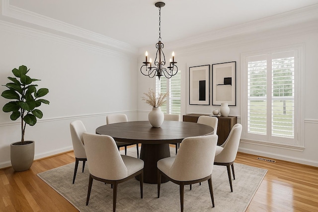 8224 Victory Trl, Brentwood, TN 37027 - dining space featuring a chandelier, ornamental molding, light wood finished floors, and baseboards