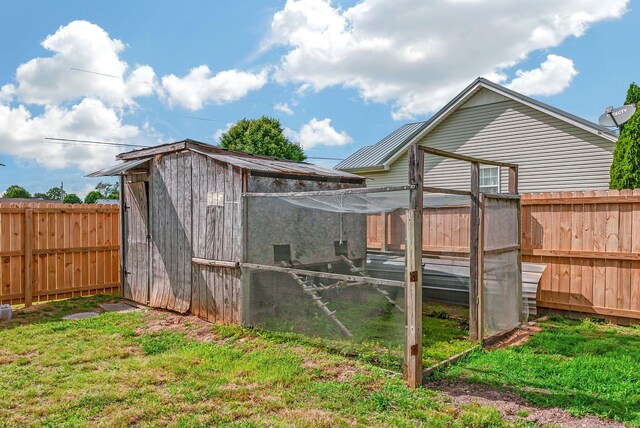 210 Edgewood Dr, Hohenwald, TN 38462 - view of poultry coop with a lawn and a fenced backyard