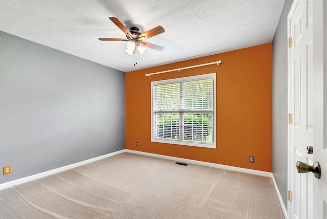 210 Edgewood Dr, Hohenwald, TN 38462 - spare room featuring visible vents, baseboards, ceiling fan, a textured ceiling, and carpet