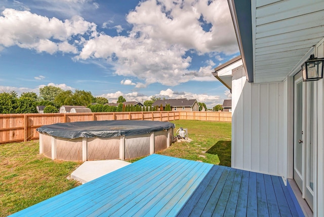 210 Edgewood Dr, Hohenwald, TN 38462 - wooden deck featuring a fenced backyard, a fenced in pool, and a yard