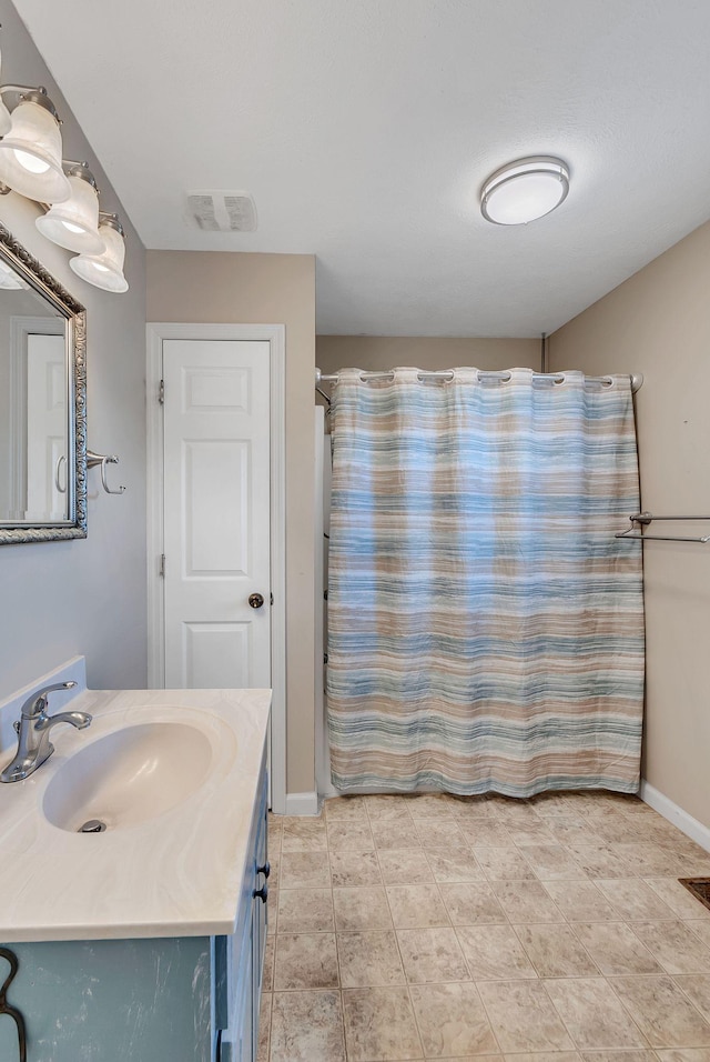 210 Edgewood Dr, Hohenwald, TN 38462 - bathroom with vanity, baseboards, curtained shower, and visible vents