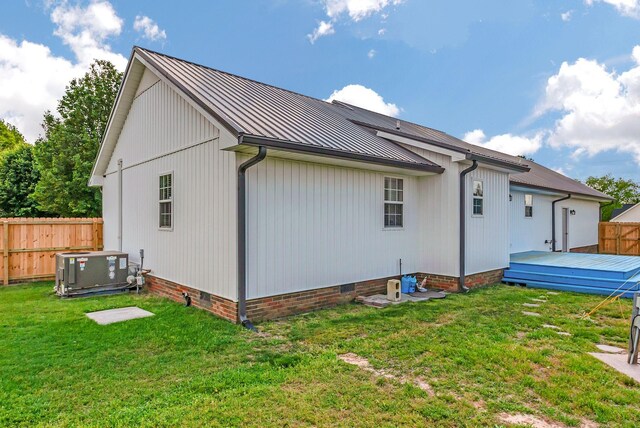 210 Edgewood Dr, Hohenwald, TN 38462 - rear view of property with crawl space, a standing seam roof, metal roof, a wooden deck, and fence