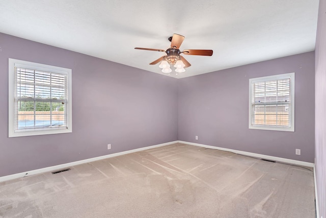 210 Edgewood Dr, Hohenwald, TN 38462 - carpeted spare room featuring visible vents, a ceiling fan, and baseboards
