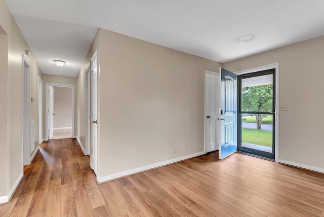 210 Edgewood Dr, Hohenwald, TN 38462 - spare room with baseboards and light wood-style flooring