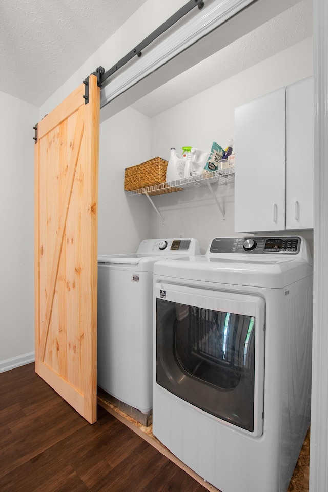 2011 Spring Meadow Cir, Spring Hill, TN 37174 - laundry area with washing machine and dryer, dark wood finished floors, cabinet space, and a barn door
