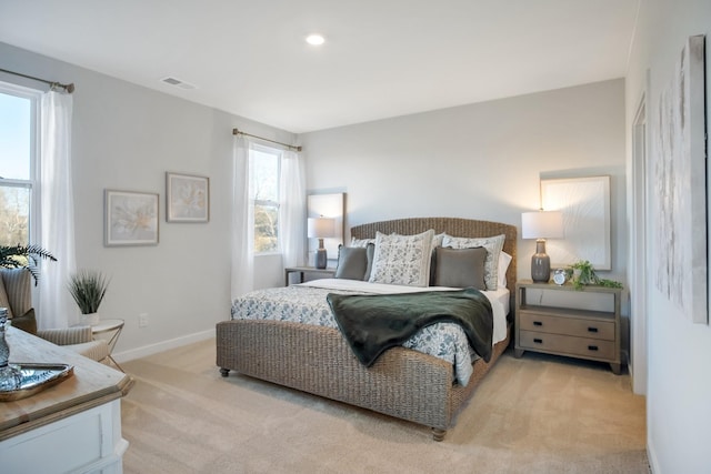 bedroom with visible vents, recessed lighting, baseboards, and light colored carpet