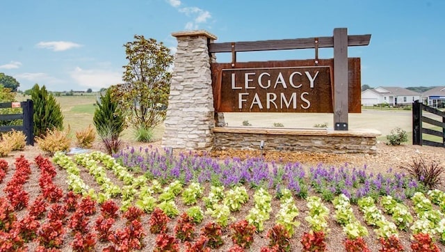 community sign featuring fence