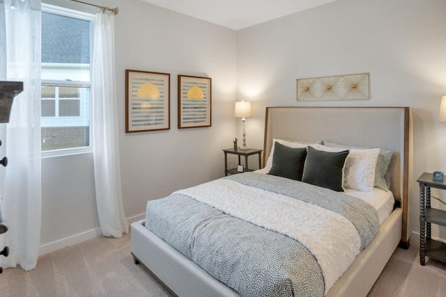 carpeted bedroom with baseboards