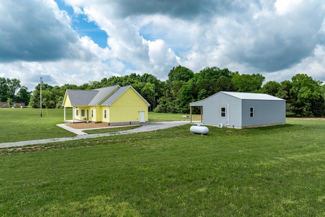 1317 Halls Mill Rd, Unionville, TN 37180 - view of yard featuring a pole building, an outbuilding, and gravel driveway