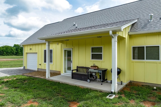 1317 Halls Mill Rd, Unionville, TN 37180 - back of property with a garage, board and batten siding, gravel driveway, and a shingled roof