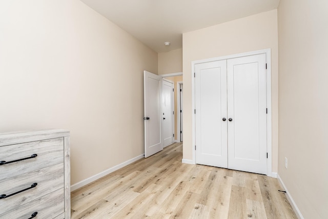 1317 Halls Mill Rd, Unionville, TN 37180 - unfurnished bedroom featuring light wood-style floors, baseboards, and a closet
