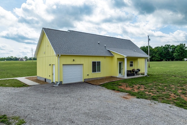 1317 Halls Mill Rd, Unionville, TN 37180 - exterior space featuring a shingled roof, a garage, board and batten siding, a lawn, and driveway