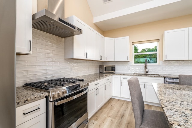 1317 Halls Mill Rd, Unionville, TN 37180 - kitchen with a sink, wall chimney exhaust hood, appliances with stainless steel finishes, and white cabinetry