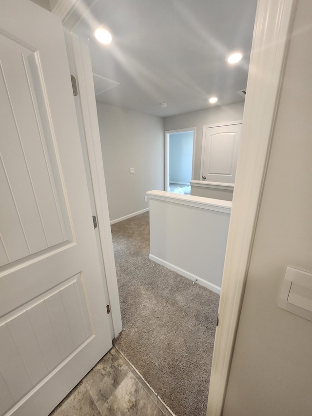 corridor with baseboards, carpet flooring, and recessed lighting