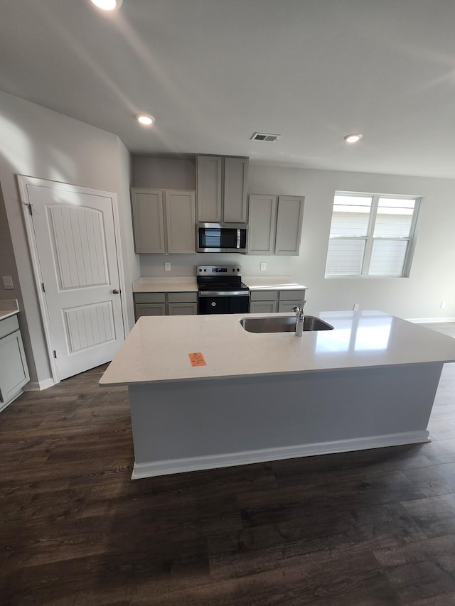 kitchen with range with electric cooktop, visible vents, gray cabinetry, stainless steel microwave, and recessed lighting