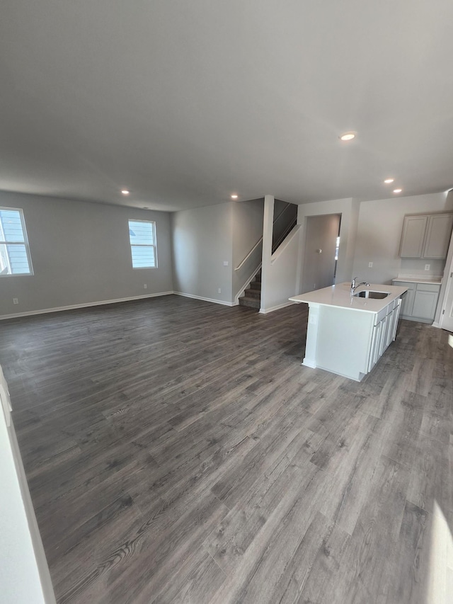 kitchen with a center island with sink, recessed lighting, and open floor plan