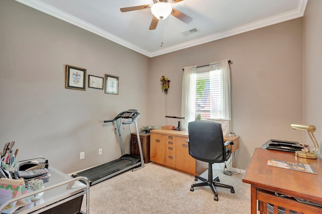 home office featuring visible vents, a ceiling fan, crown molding, and light carpet