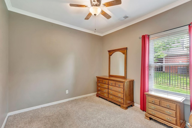 bedroom with ceiling fan, light colored carpet, baseboards, visible vents, and ornamental molding
