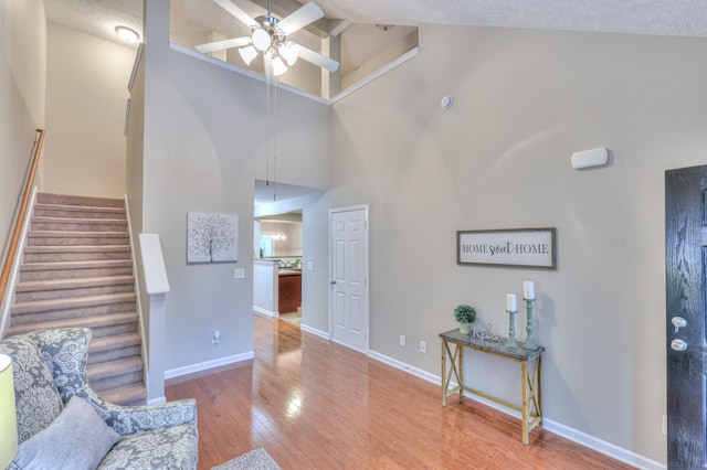 2039 Caladonia Way, Smyrna, TN 37167 - living area featuring ceiling fan, wood finished floors, high vaulted ceiling, beamed ceiling, and stairs