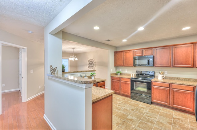 2039 Caladonia Way, Smyrna, TN 37167 - kitchen featuring brown cabinets, a textured ceiling, a chandelier, recessed lighting, and black appliances