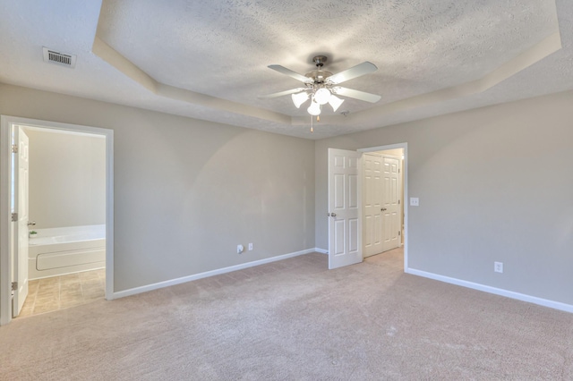 2039 Caladonia Way, Smyrna, TN 37167 - carpeted empty room with baseboards, ceiling fan, a tray ceiling, and a textured ceiling